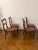 Set of Four English Carved Mahogany Dining Chairs, 20th c. Arched canted curved back with a pierced horizontal stretcher,...