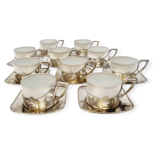 Art Deco silver-plated Argentor tea set from the 1930s, with original Karlsbad porcelain liners. 10-piece set of cups and...