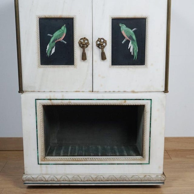 A mid-century marble and malachite safe cabinet with green velvet lined dog bed to lower section. Hand painted tropical...