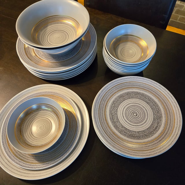 Sascha Brastoff Roman Coin fine china set features a striking mid-century modern aesthetic with a gold and gray spiral...