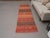 Vintage Hand-Knotted runner rug is a semi-antique vintage area rug. The '70s Eastern region of Anatolia's unique rug is...