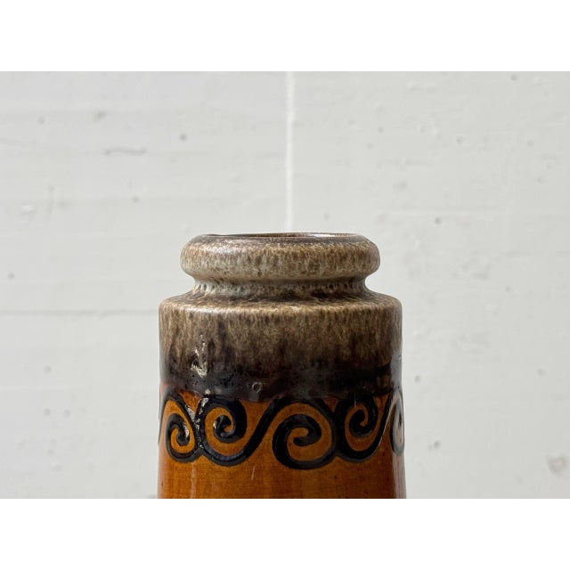 A distinctive ceramic vase, made in germany by scheurich, crafted in the typical design language of the 1970s. The...