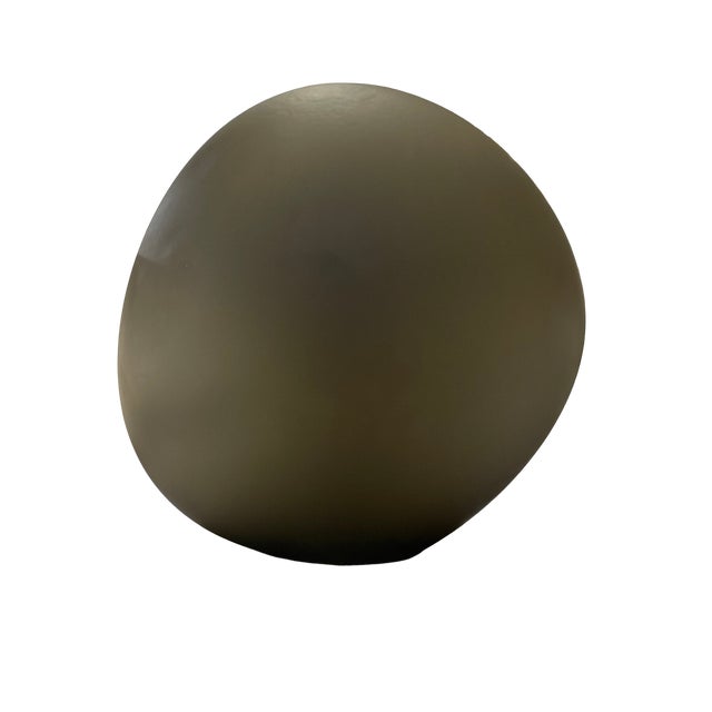 Sculptural table lamp with an abstract shape. Finished in a matte, grayish smoke color, in a globular shape. European Plug...