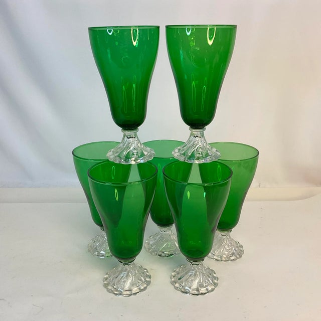 Vintage Home is pleased to present this set of 7 Depression Era pressed glass Bottle Green cut to Clear pedestal Water or...
