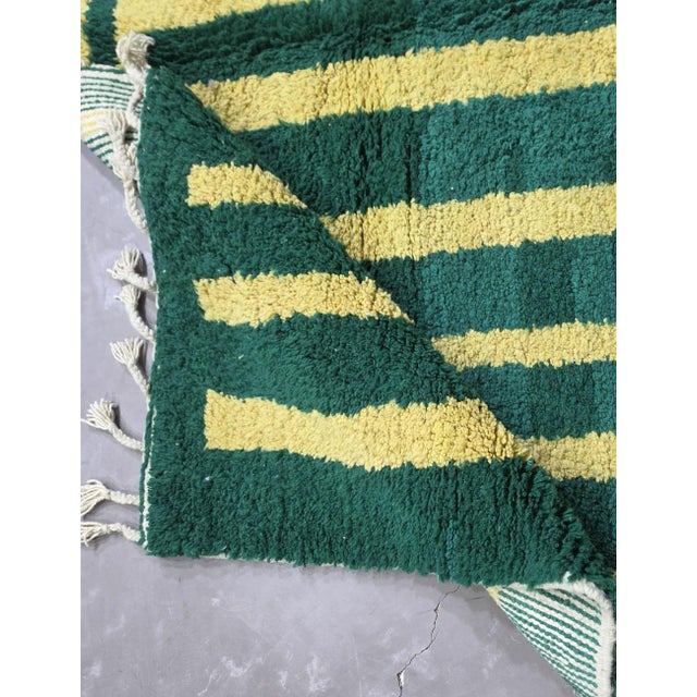 Green Moroccan Rug – Handmade Geometric Berber Wool Rug This bold handmade Moroccan rug features a deep green wool...