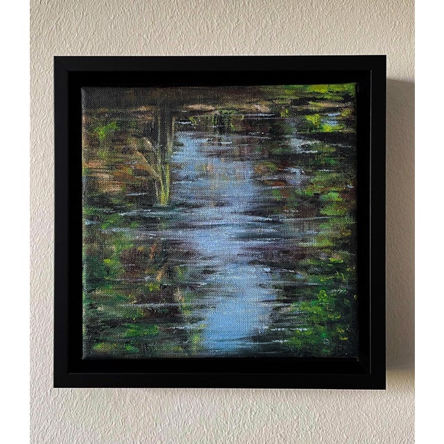 Still Waters I captures the serene essence of a tranquil water surface, reflecting a harmonious interplay of soft blues...
