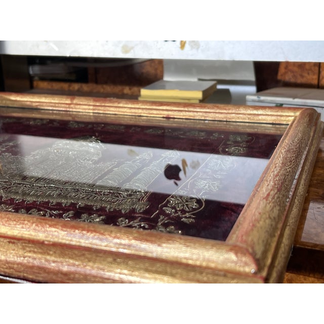 The intricate depiction of the Taj Mahal is created using heavy, wound with metallic gold and silver thread. The...