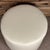 Handcrafted in the USA, this elegant round ottoman is upholstered in premium Italian leather for a sophisticated addition...
