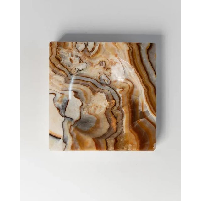 This vintage marble ashtray from the 1970s features a striking marbled mix of beige, black, and brown tones that add depth...