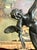 A graceful antique bronze-clad sculpture by the Pompeian Bronze Company depicting the celebrated Danseuse aux Aras (Dancer...