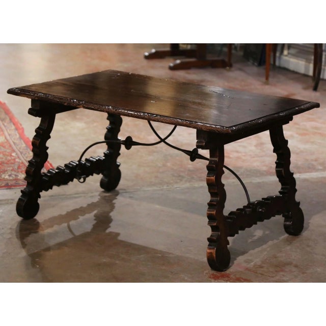 Rich in character and traditional Spanish craftsmanship, this antique Baroque trestle coffee table features a beautifully...