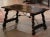 Crafted in Spain circa 1780, and built of solid walnut, the rectangular antique trestle coffee table stands on two carved...