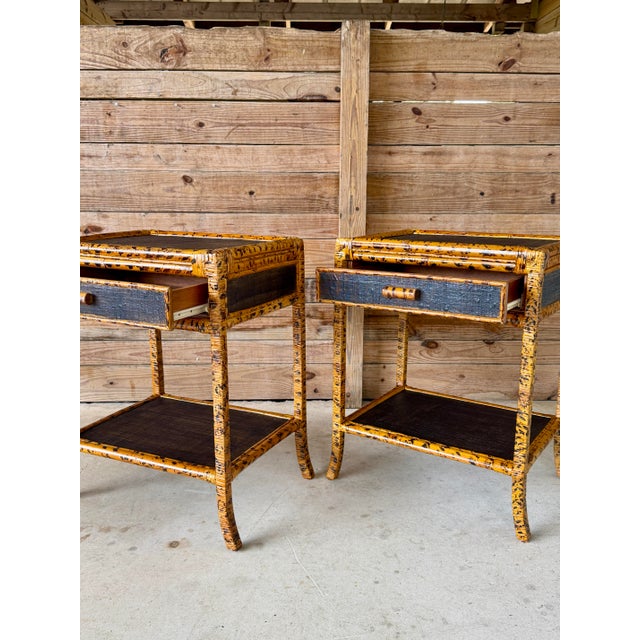 Striking pair of vintage tortoise finish rattan nightstands featuring a sculptural floating design and inset grasscloth...