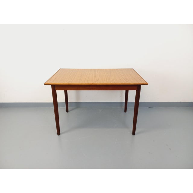 Vintage rectangular dining table in Scandinavian style from the 1950s/60s, made of teak, with a rectangular top featuring...