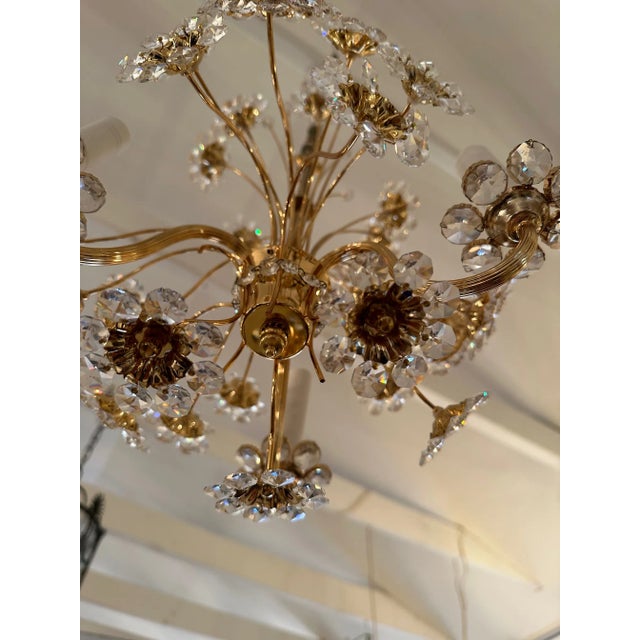 Elegant glistening flower motif vintage chandelier having delicate 24 carat plated stems and floral centers with crystal...