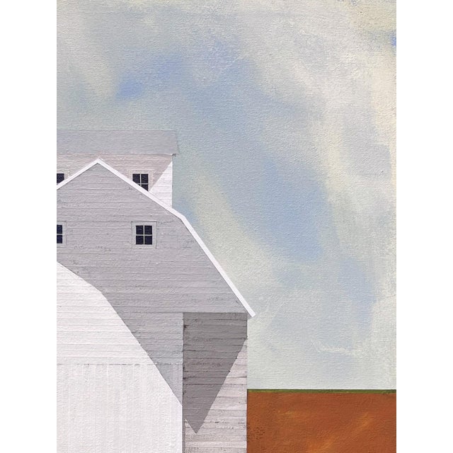 On the Outskirts by Justin Wheatley is an acrylic painting on canvas of a small white barn set far back in an open field....