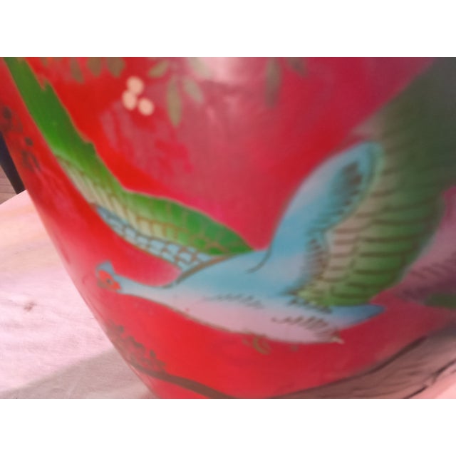 This is a vintage Japanese metal floor vase colored by a vibrant hand painted red ground with a bird in flight and a tree,...