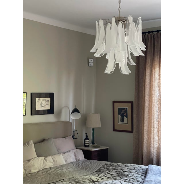 Pair of two Bold White Murano Chandeliers. Petal Formed Glass Prisms in Traditional Italian Mid-Century Style. The glass...