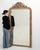 Here is a mirror, its cream/gold carved frame with leaf crest the first thing to catch the eye. Dating to 19th Century and...