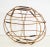 Folk art style oval/elliptical bamboo sculpture, contemporary. Lengths of lighter colored bamboo form the larger ovals...