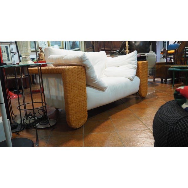 Two Baialonga sofas and one armchair, designed by Studio Visette for Bonacina in the 1990s. Woven leather frame, white...