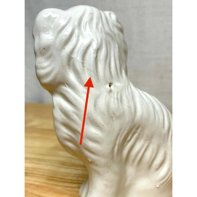 Pair of Diminutive Antique Staffordshire black & white seated Spaniels, C. 1860s England, Circa 1860s A good pair of...