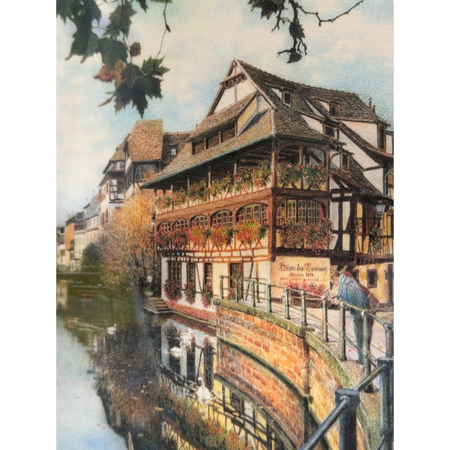Vintage European architectural cityscape depicting La Maison des Tanneurs (The Tanners’ House) in Strasbourg’s historic...