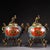 This is a matching pair of cloisonné enamel incense burners (censers), each featuring a domed lid topped with a gilt...