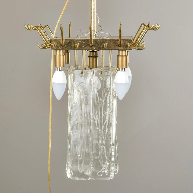 Found in Italy, this hanging light fixture dates from the 1960s and features Murano glass pendants hung from a polished...