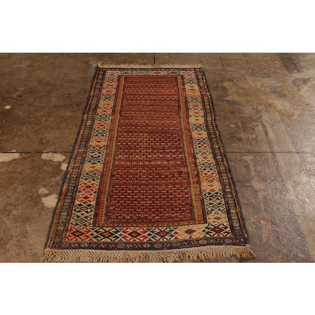 Hand knotted in wool originating from Russia circa 1890-1900, this antique rug connotes a 19th-Century Soumak design with...