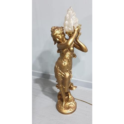 This is a huge Art Nouveau antique spelter lamp of a lady holding a flame by 'Auguste Moreau', in excellent condition. Up...