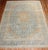 An early 20th Century room size Persian Kashan hand-knotted rug with a traditional medallion and border pattern in blue...