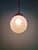 Art Deco pendant light in frosted molded pressed glass with a brass mount, 1930s. The pendant is compatible with a B22 LED...