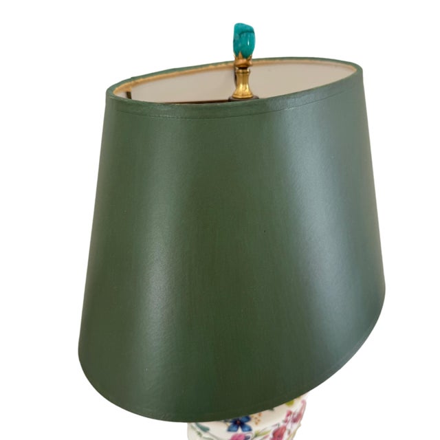 Expressing classic Neoclassical charm, this vintage table lamp by As You Like It, Inc. features a sculpted ceramic urn...