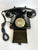 Here is a vintage-inspired rotary style desk telephone in a classic black finish with warm brass-tone dial detailing....