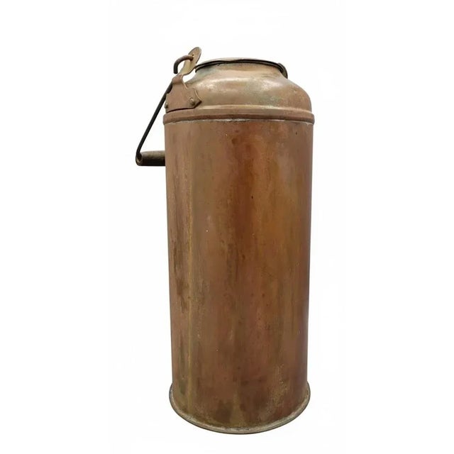 Striking antique English copper milk canister with its original matching drop-in copper lid, steel wire bail, and turned...