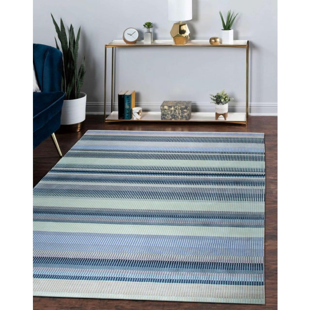 Jade Sophisticated Mauve Handmade Wool Rug, Country of Origin: India. This piece showcases the exceptional quality of...