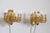 Beautiful and refined 20th century, 1970s circa, pair of wall lights or sconces with five lights each. Made of gilded and...