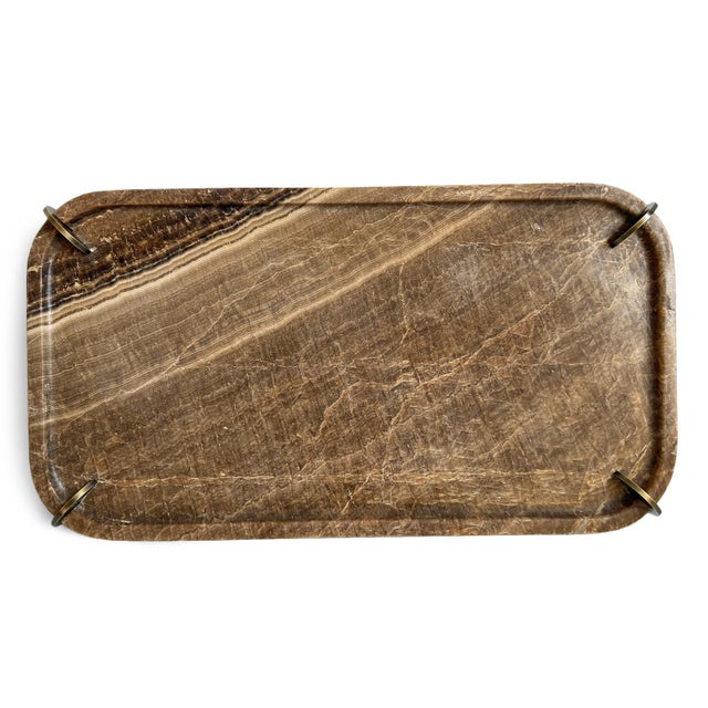 Natural onyx tray with brass finish steel coin corner stands. Striking coloring from browns, to taupes, to cream accents,...