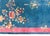 A stunning example of early 20th-century Chinese Art Deco weaving, this rug features a deep navy blue field framed by a...