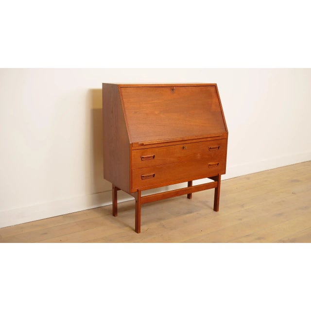 Looking for a stylish workstation or a decorative cabinet? This vintage teak secretaire is a perfect match. The secretaire...