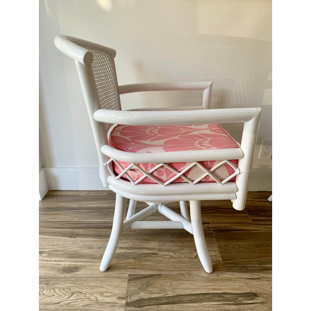 Vintage White Bamboo Swivel Chairs With Floral Pink Seat Cushions a