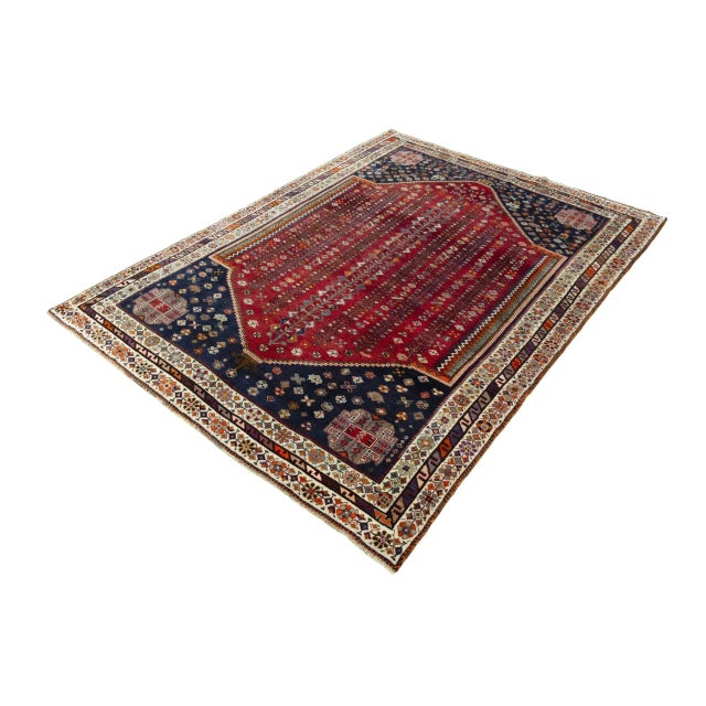 This magnificent hand-knotted Shiraz Ghashghai rug is a striking example of traditional nomadic craftsmanship. Crafted in...
