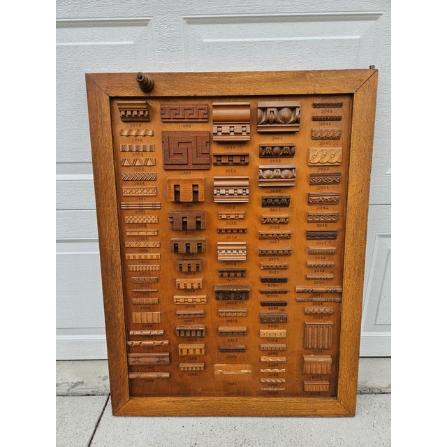 Antique mercantile double-sided display of various wood trim, molding or wooden appliques. This panel is sure to catch the...