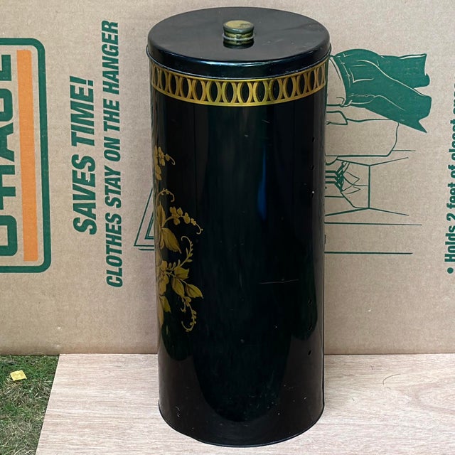 Vintage small metal hamper with lid in black with gold border and floral design. Original holes on backside for airflow....