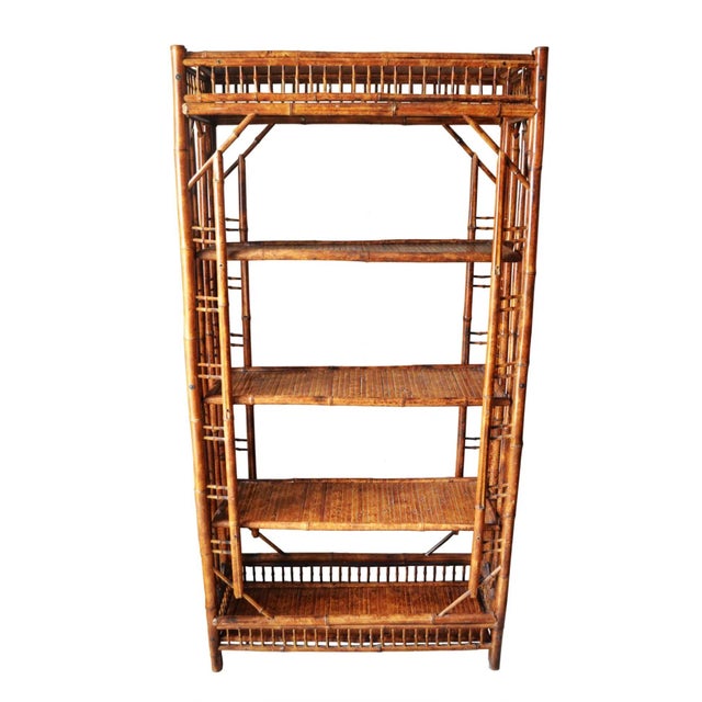 Vintage bamboo etagere with a wonderful tortoise shell finish. In wonderful vintage condition, virtually flawless!! One...