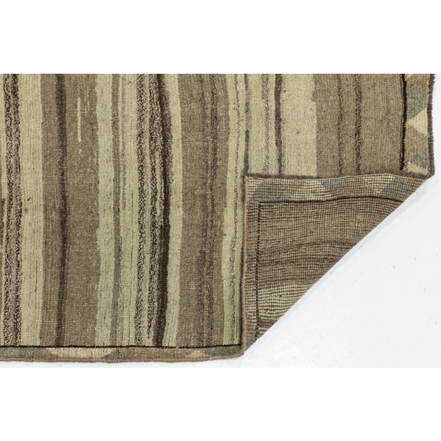 This modern Gabbeh rug is a perfect blend of ancestral craftsmanship and contemporary minimalism. The design embraces a...