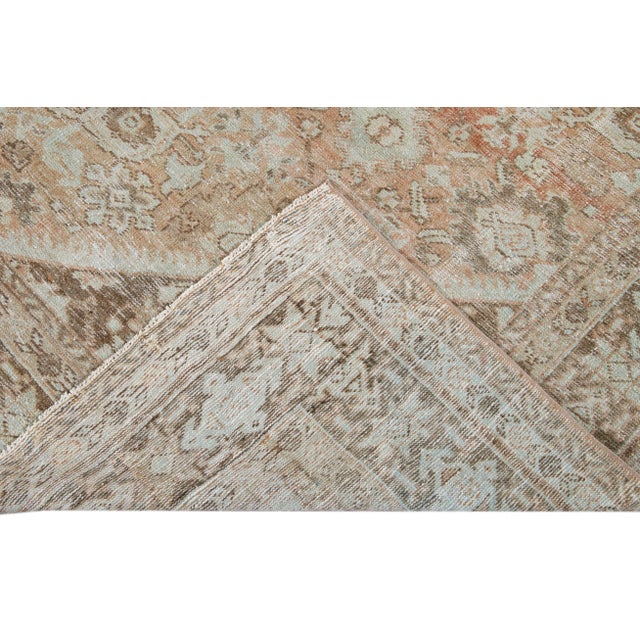 Beautiful hand-knotted antique mahal wool rug with the orange rust field. This Persian rug has a brown featuring a...