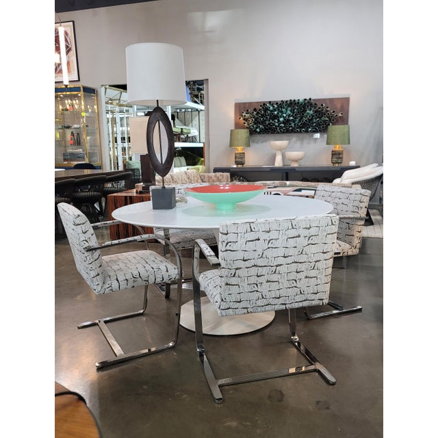 These are original Mies van der Rohe for Knoll Brno chairs in steel frames with armpads. We have reupholstered in a rich...