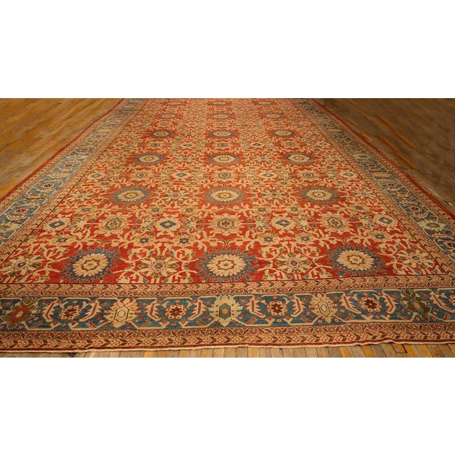 This majestic Antique Sultanabad rug, dating to circa 1890, is a palatial-sized masterpiece of Persian weaving. Spanning...